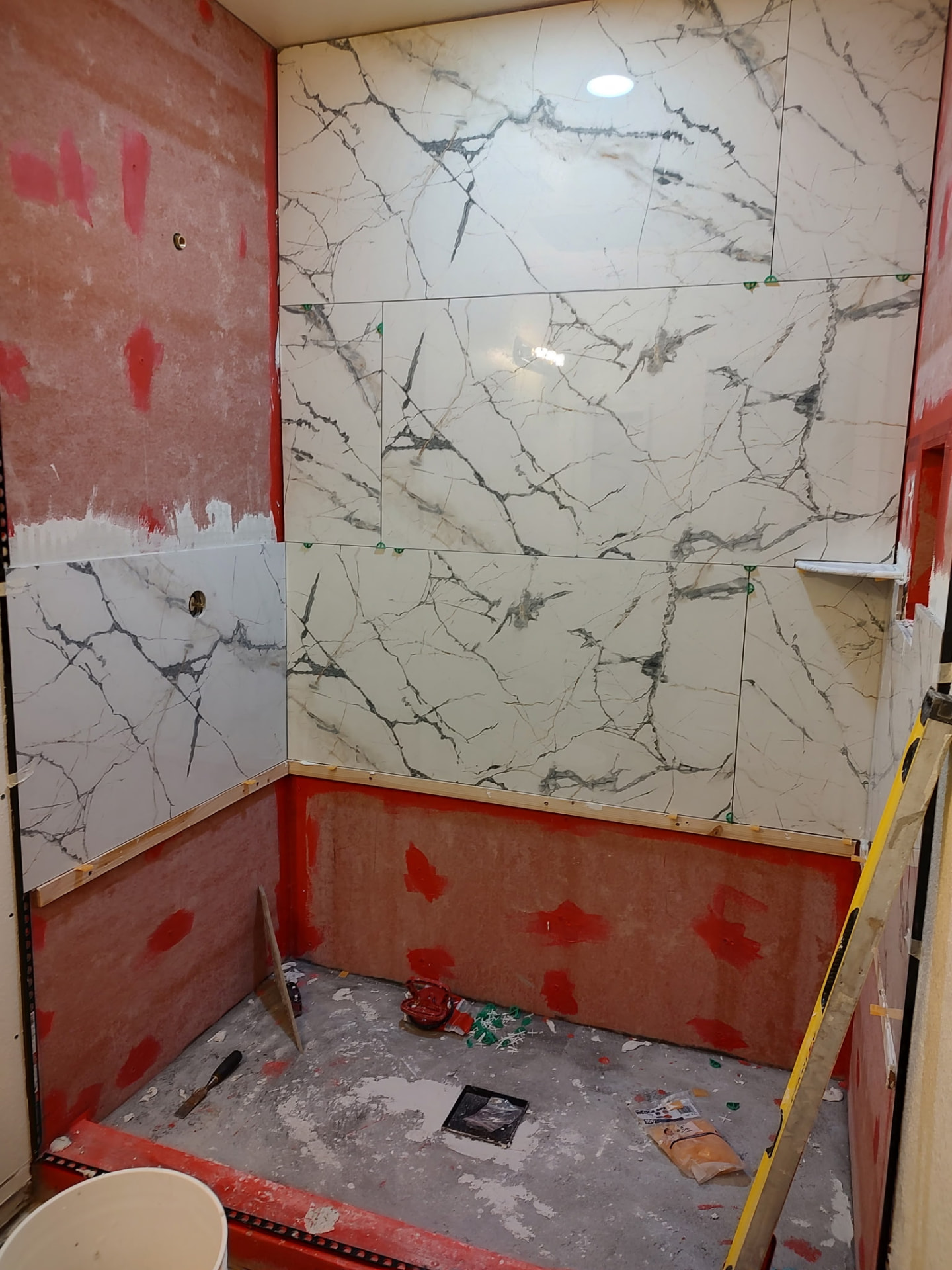 Walk-in shower gut & tile — before