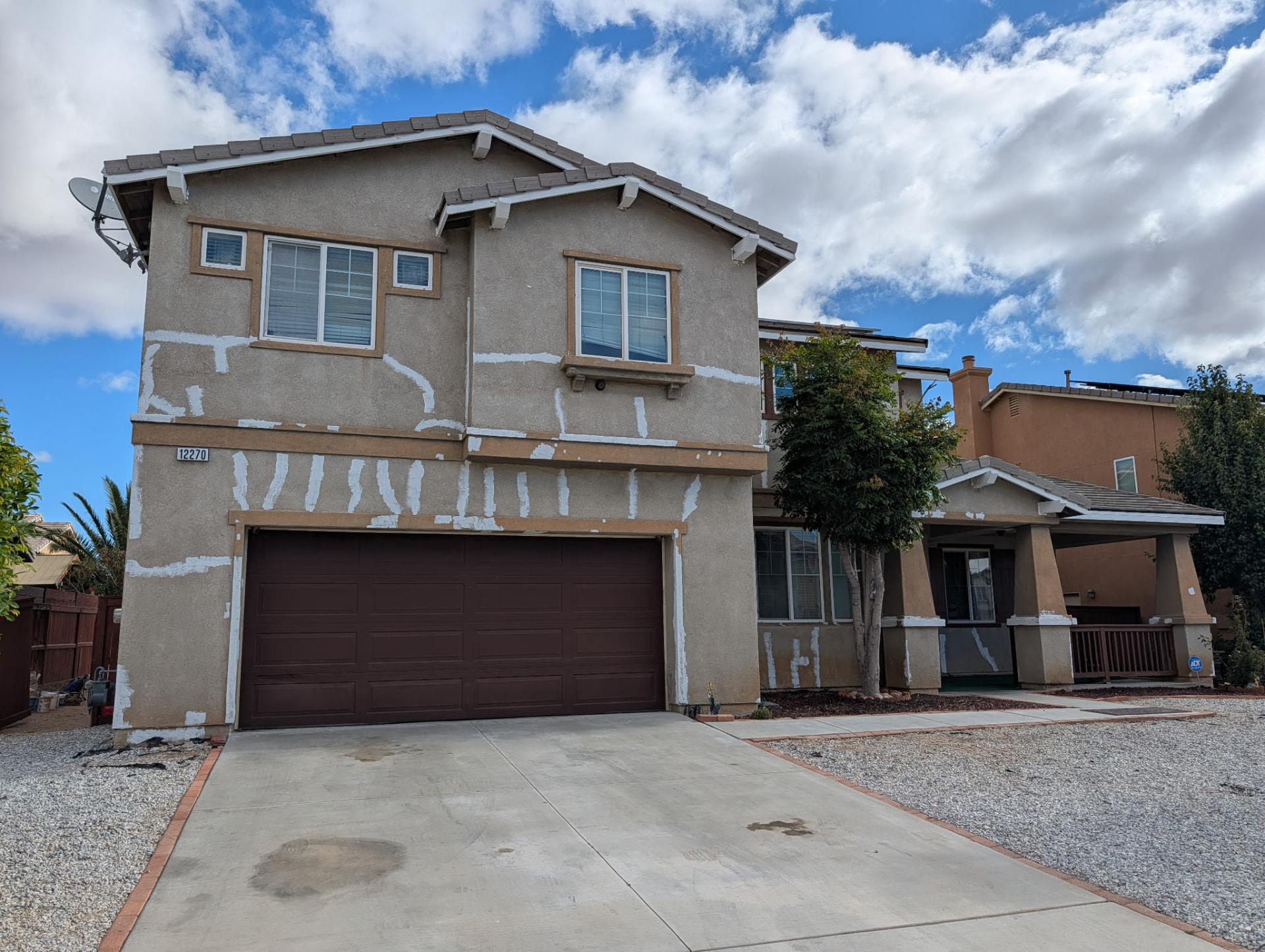 Stucco patch, trim & full repaint — before